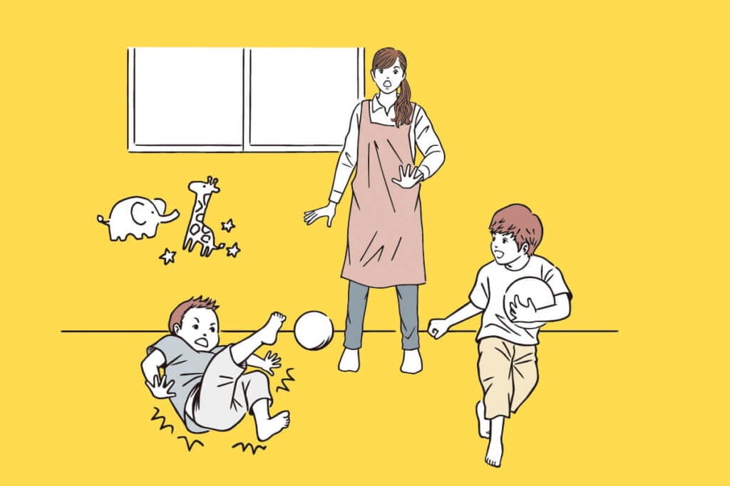 Caregiver stands with hands out, watching two children playing with a ball indoors.